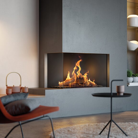 Cheminée à gaz VISIO 90 LC en tant que cheminée d'angle à gauche avec d'authentiques flammes de gaz devant des fauteuils minimalistes en revêtement rouille