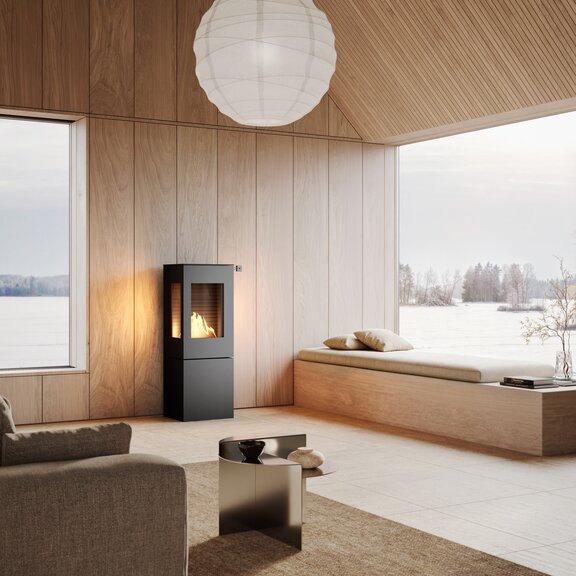 Poêle au bioéthanol NEXO 120 BIO de couleur noire dans un espace de vie naturel