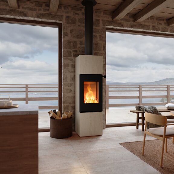 Holz Kaminofen NEXO 160 Porto in der Farbe Schwarz im Wohnraum mit einer Steinwand