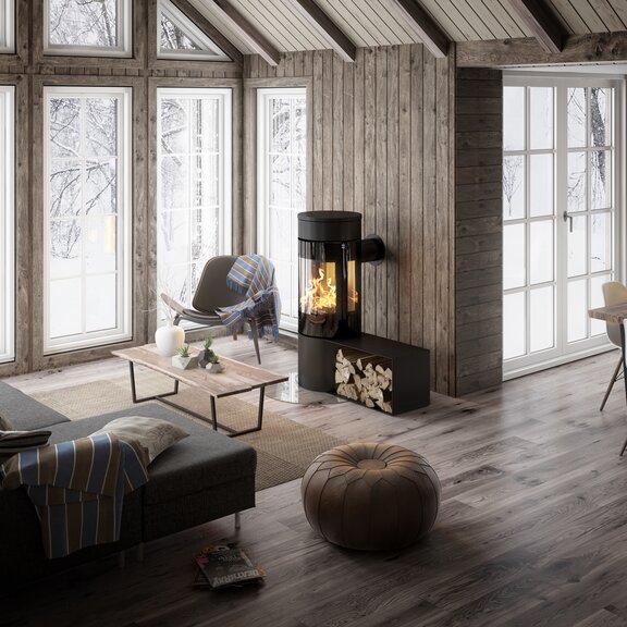 Poêle à bois VIVA 120 L en noir avec banc dans une maison en bois moderne dans la forêt