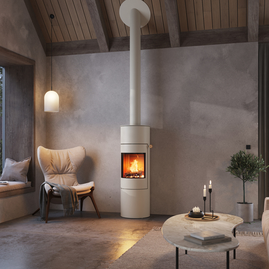 Poêle à bois VIVA 140 L de couleur sable avec porte en acier dans un appartement moderne dans les tons de terre